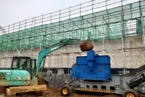 Use a small excavator to mix and crush the soil, adding water during mixing