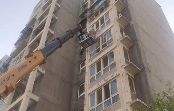 Repair of detached exterior wall cladding
