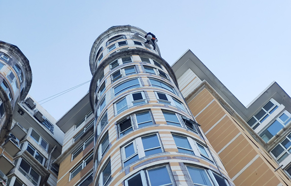 Repair of detached exterior wall cladding