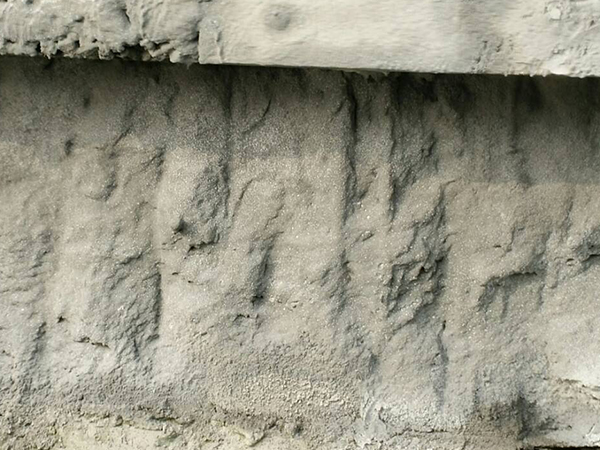 Repair of exposed reinforcement due to concrete corrosion in docks