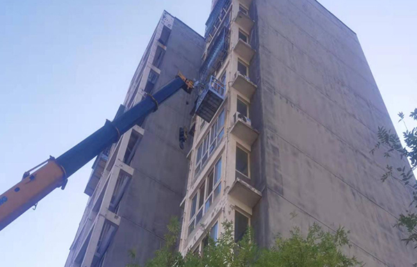 Repair of detached exterior wall cladding